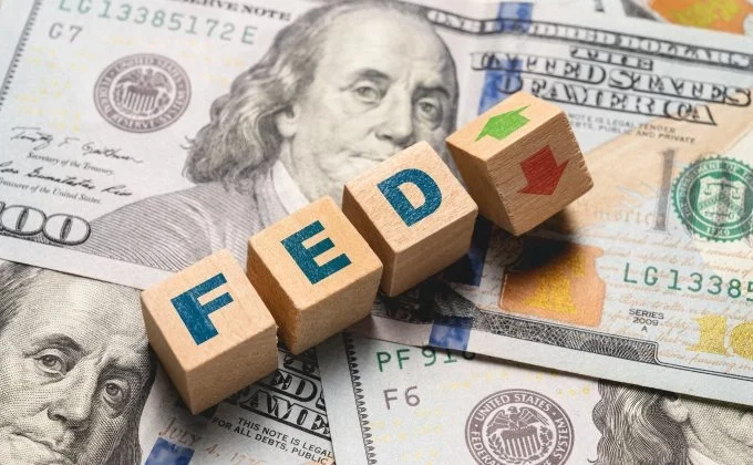 Fed Rate Hold Fuels Dollar Amid Global Market Volatility
